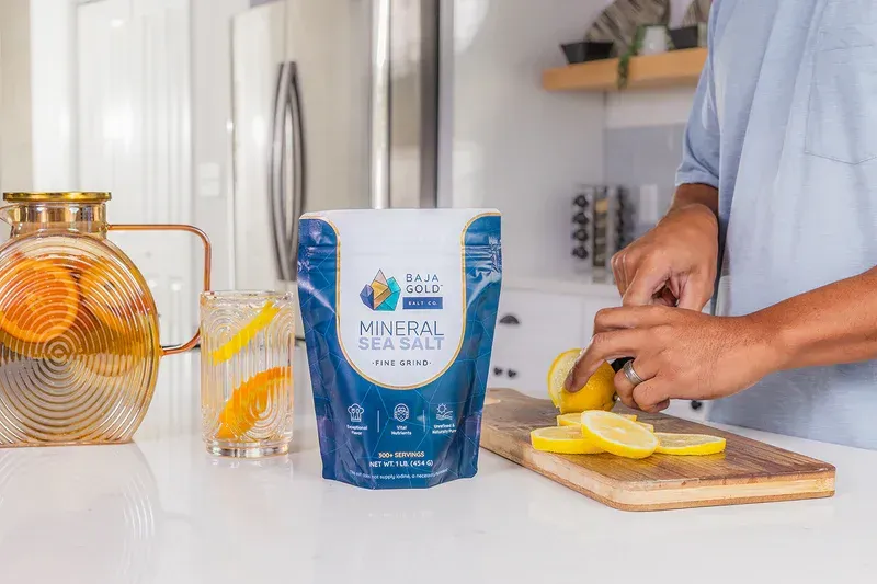Baja Gold Mineral Sea Salt used in a kitchen with citrus